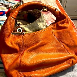 Medium size shoulder burnt orange purse Michael Kors